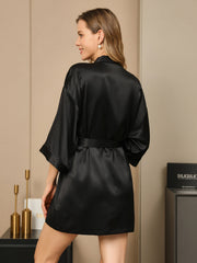 Women's black 100% Mulberry silk 3/4 sleeve short kimono robe with wrap design.