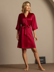 Women's mulberry silk 3/4 sleeve kimono wrap robe in rich red, tied at the waist.