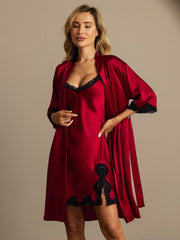 Red mulberry silk nightgown and robe set with black lace trim, worn by a woman.
