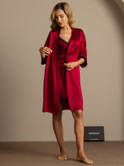 Women's red mulberry silk nightgown and robe set with black lace trim.