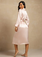 Women's blush pink mulberry silk belted long lapel robe with pocket design.