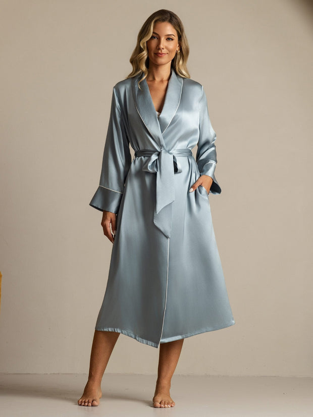 Women's grayish blue mulberry silk long lapel robe with pockets and white trim, tied at the waist.