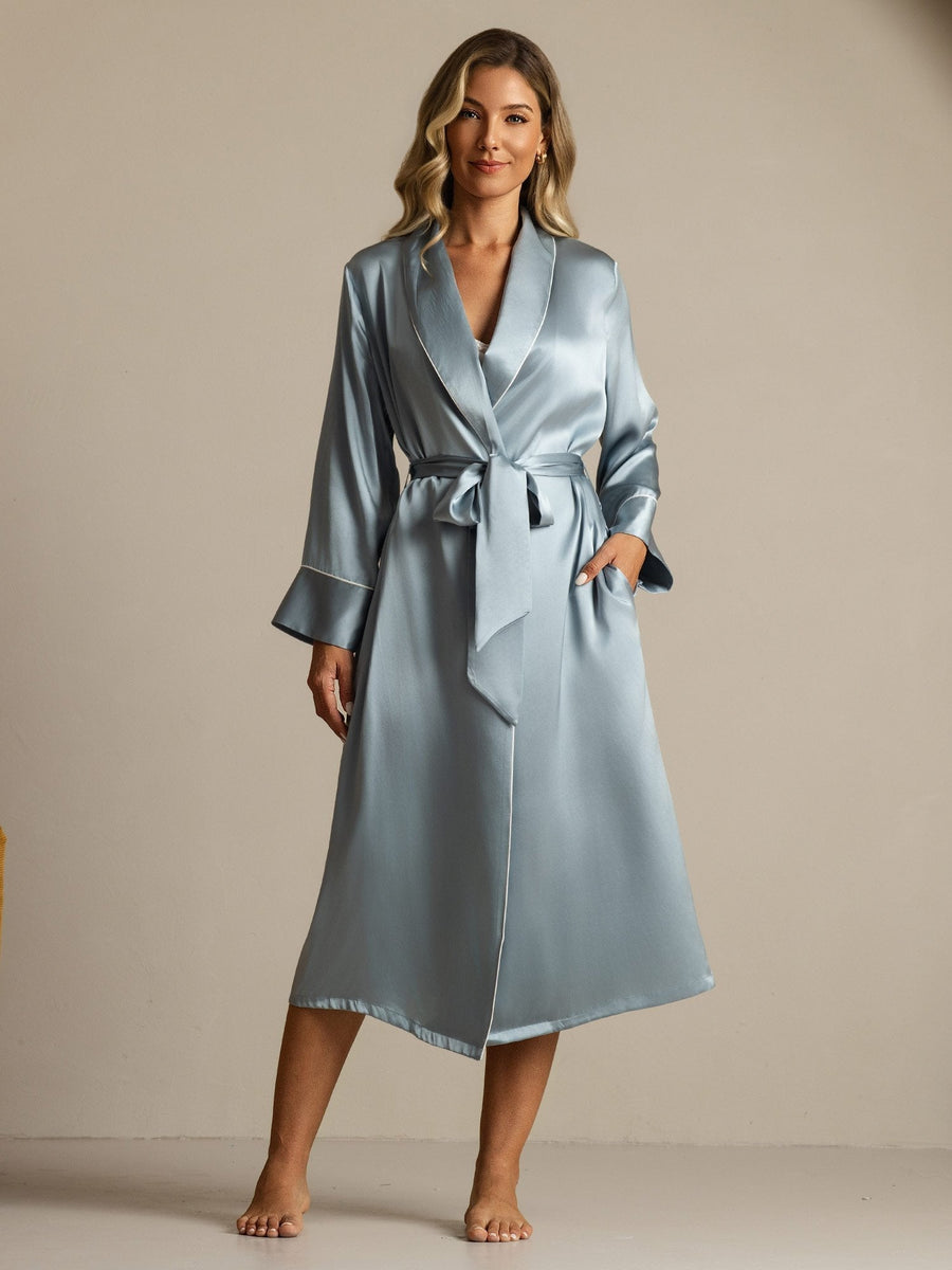 Women's grayish blue mulberry silk long lapel robe with pockets and white trim, tied at the waist.