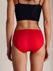 Red mulberry silk bikini panty with bow detail, shown from the back on a model.