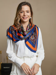 Mulberry silk bohemian square scarf, 86x86cm, with orange and blue borders and a colorful paisley pattern.