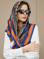 Mulberry silk bohemian square scarf with vibrant paisley and geometric patterns, blue and orange stripes.