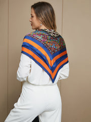 Bohemian mulberry silk square scarf with colorful paisley and geometric patterns, blue and orange border.