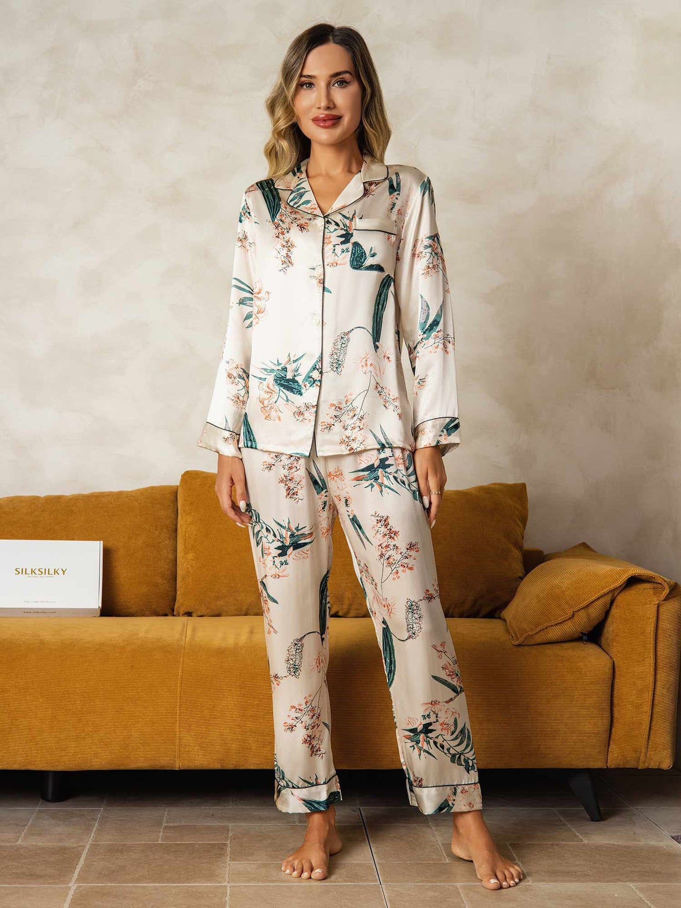 Women's mulberry silk botanical print long sleeve pajamas set in cream with green and pink floral design.
