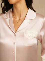 Pink mulberry silk button-up nightshirt with white piping and delicate lace pocket design.