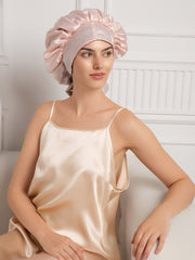 Two-tone mulberry silk casual bonnet with long ribbons, worn by a woman in a silk camisole.