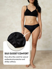 Black mulberry silk bikini panty with a silk gusset, shown on a model.