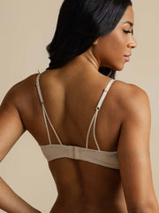 Woman wearing a beige 100% Mulberry Silk Classic Lace Trim Wireless Bra, seen from the back.