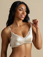 Woman wearing a cream 100% Mulberry silk classic lace trim wireless bra.