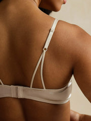 Champagne mulberry silk wireless bra with adjustable straps and lace trim.