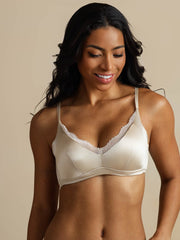 Women's champagne mulberry silk wireless bra with delicate white lace trim.