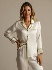 Women's ivory mulberry silk pajama set with long sleeves and green contrast piping.