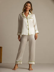 Women's ivory mulberry silk pajama set with long sleeves and green contrast piping.