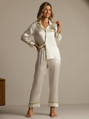 Women's ivory mulberry silk pajama set with long sleeves and green contrast piping.