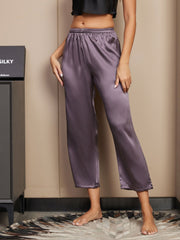 Women's mulberry silk classic sleep pants in a rich purple-gray color, featuring a relaxed fit and elastic waist.