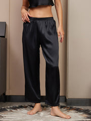 Black 100% Mulberry silk classic women's sleep pants with an elastic waist, shown on a model.