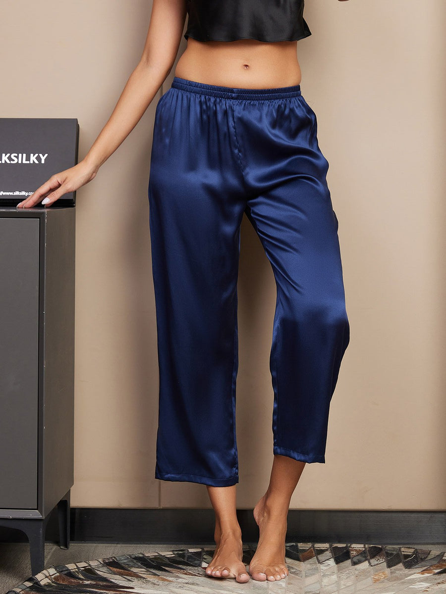 Women's classic dark blue 100% mulberry silk sleep pants, cropped style, with an elastic waistband.