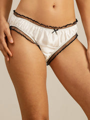 White mulberry silk panty with black ruffle trim and bow detail.