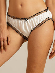 White mulberry silk panty with black ruffle sheer trim and a small black bow.
