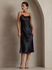 Black 100% Mulberry Silk Cowl Neck Midi Dress with spaghetti straps, worn by a woman.