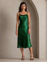 Emerald green mulberry silk cowl neck midi dress on a woman.