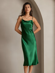 Emerald green mulberry silk cowl neck midi dress on a woman.