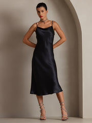Black 100% Mulberry silk cowl neck midi dress with spaghetti straps, worn by a woman.