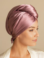 Mulberry silk hair towel wrap in a soft rose color, styled on a woman.