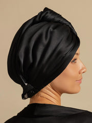Black mulberry silk hair towel wrap on a woman, designed for quick dry and frizz-free hair.