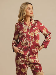 Women's mulberry silk pajamas in red with gold ornate dragon print, long sleeves, and notch collar.