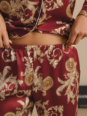 Women's mulberry silk pajamas: red long-sleeve top and pants with a gold dragon print.