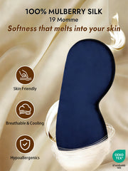Navy blue 100% Mulberry silk sleep eye mask with elastic band, shown on a cream silk background.