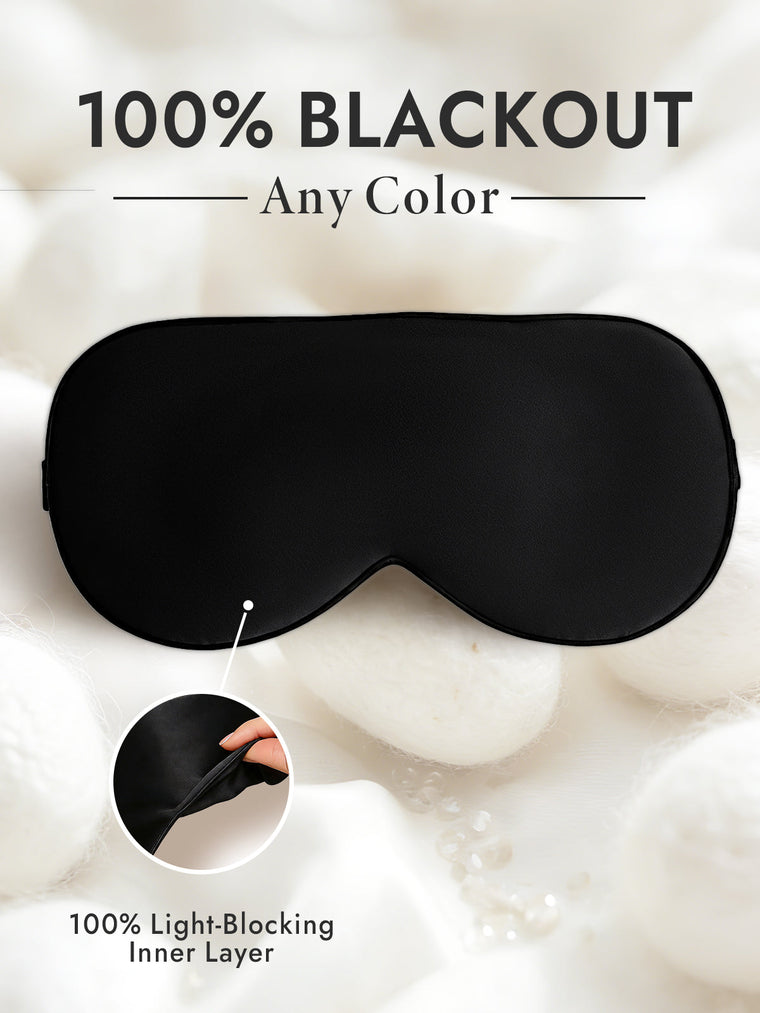 Black 100% Mulberry silk sleep eye mask with elastic band and light-blocking inner layer.