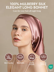 Elegant rose gold mulberry silk bonnet for long hair, worn by a woman.