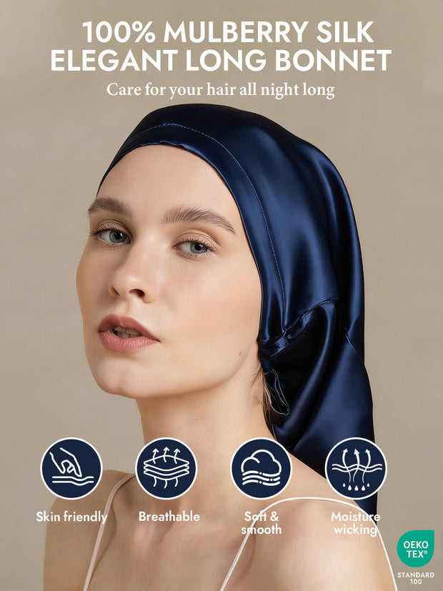 Elegant navy blue mulberry silk bonnet for long hair, shown on a woman.