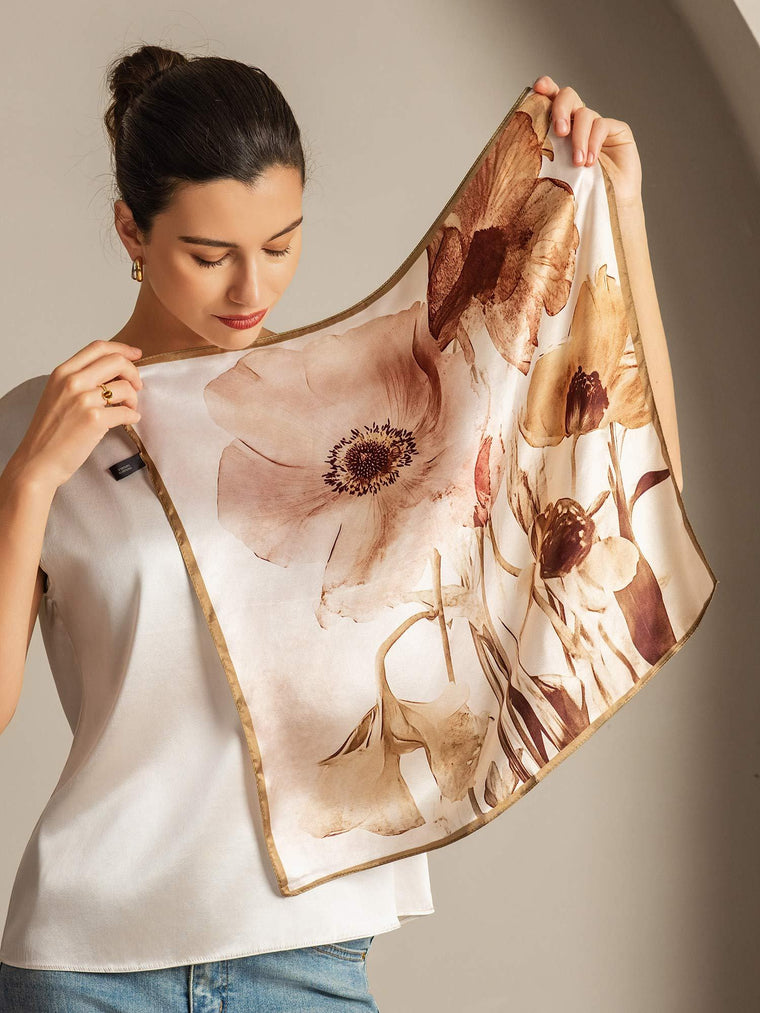 Women's 100% mulberry silk floral square scarf with gold trim, featuring large brown and beige flowers.