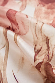 Mulberry silk floral square scarf with gold trim, featuring soft pink and beige tones.