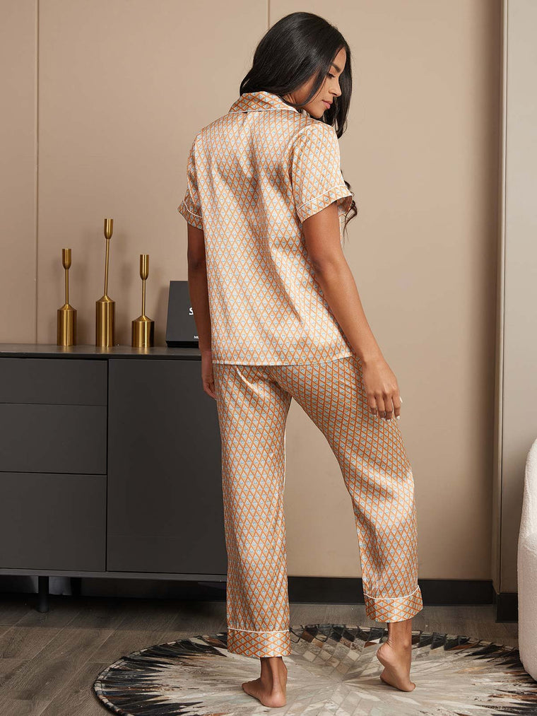 Women's mulberry silk geometric print short sleeve pajama set with notch collar and pants.