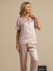 Women's mulberry silk geometric print short sleeve pajama set with notch collar and pants.