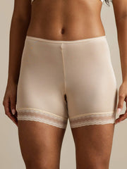 Nude mulberry silk anti-chafing shorts with delicate lace trim on waist and hem.