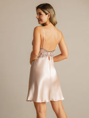 Blush pink mulberry silk nightgown with black lace trim, V-neck, and spaghetti straps.