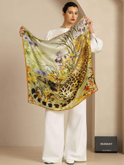 Mulberry silk leopard & floral scarf (90x90cm) held by a woman in white.