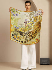 Mulberry silk leopard & floral scarf (90x90cm) held by a woman.
