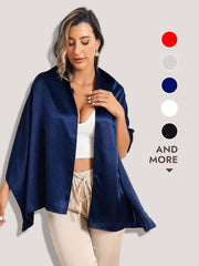 Woman modeling a dark blue mulberry silk long scarf/shawl, draped over her shoulders.