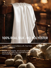 White mulberry silk long scarf draped over a wooden chair, highlighting its smooth, luxurious texture.