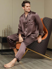 Men's coffee mulberry silk long sleeve pajamas set with white piping, shown on a man sitting.